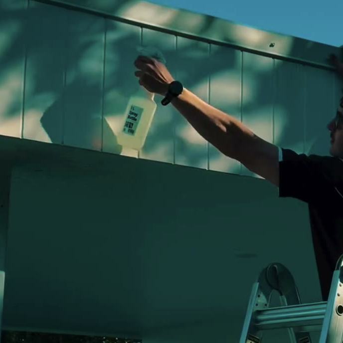 Washing down a house wall